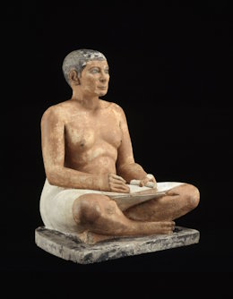 The crouching scribe is an Egyptian sculpture in Louvre Museum The crouching scribe is an Egyptian sculpture in Louvre Museum