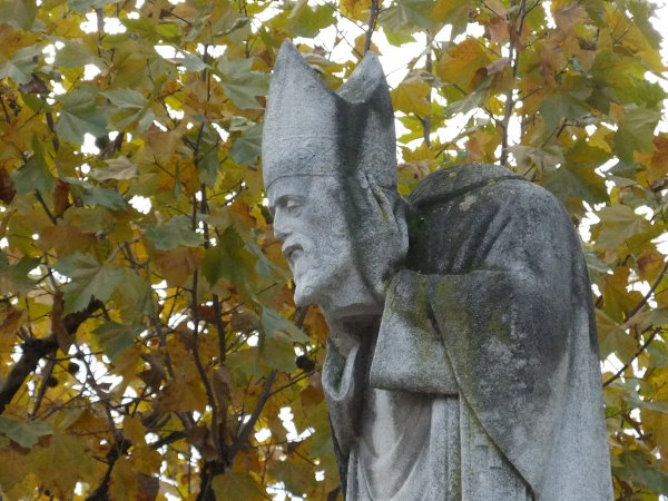 Statue of Saint-Denis wearing his head in Montmartre Statue of Saint-Denis wearing his head in Montmartre